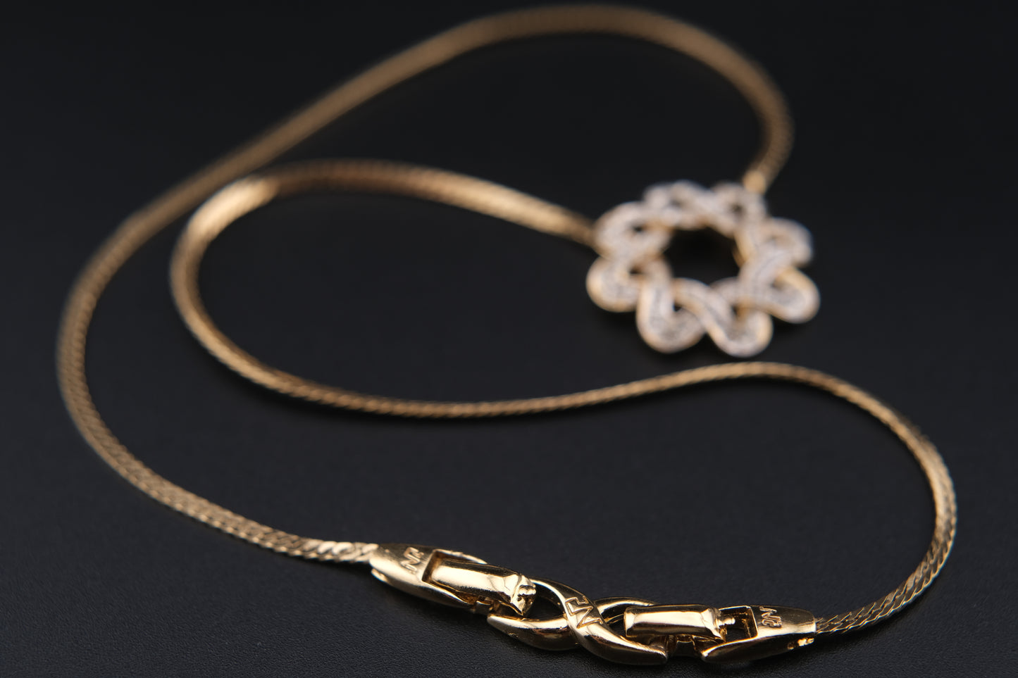 Nina Ricci Star Knot Crystal Necklace – Gold-Tone Choker Style
