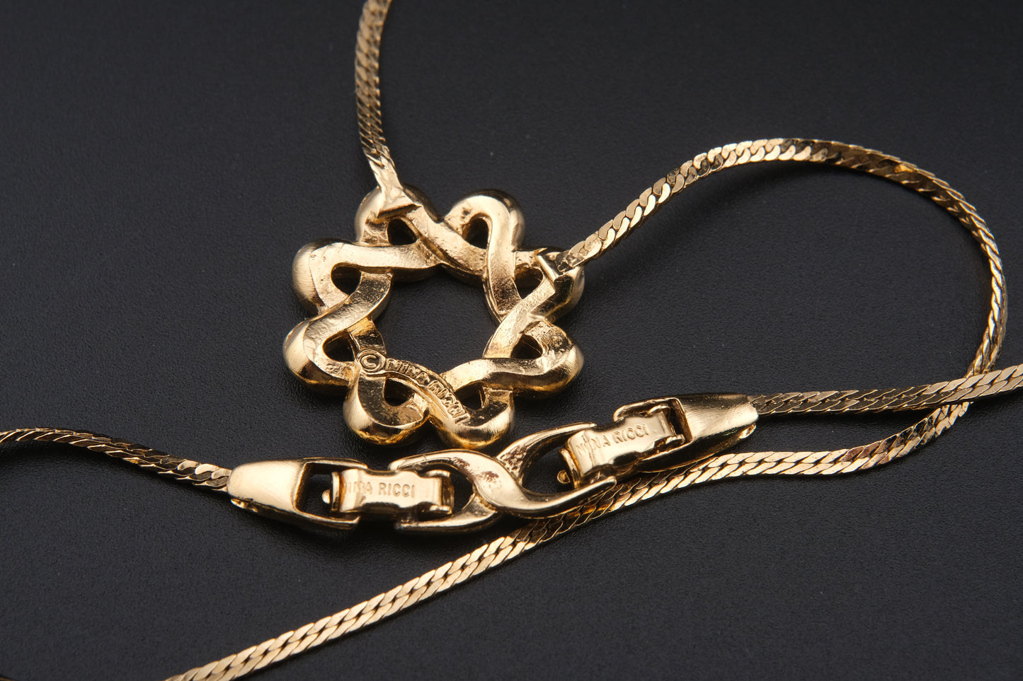 Nina Ricci Star Knot Crystal Necklace – Gold-Tone Choker Style