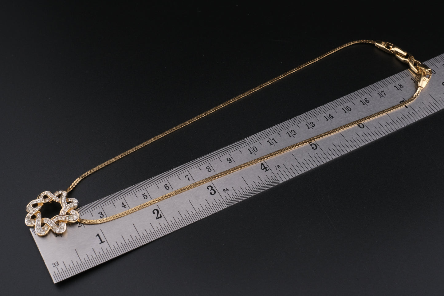 Nina Ricci Star Knot Crystal Necklace – Gold-Tone Choker Style