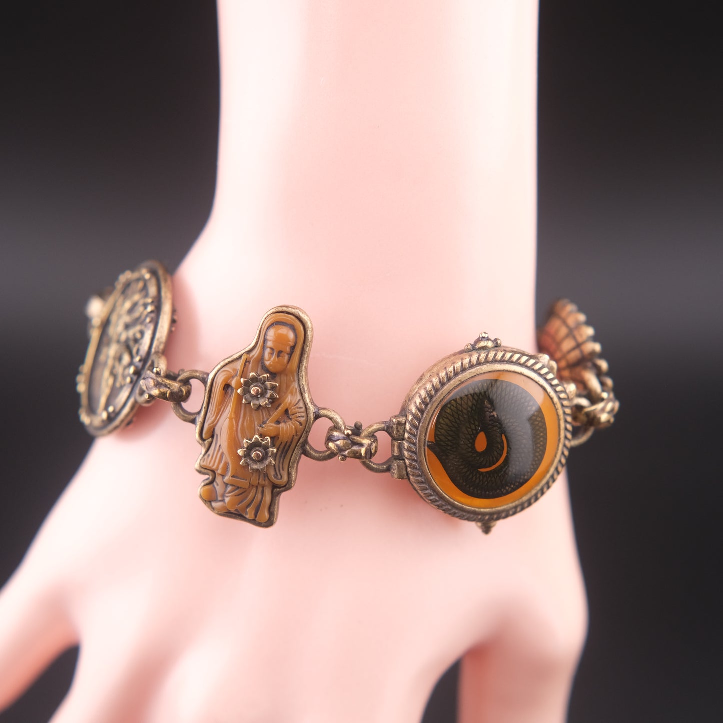 Vintage Multi-Charm Bracelet with Religious and Symbolic Motifs – Snake Locket