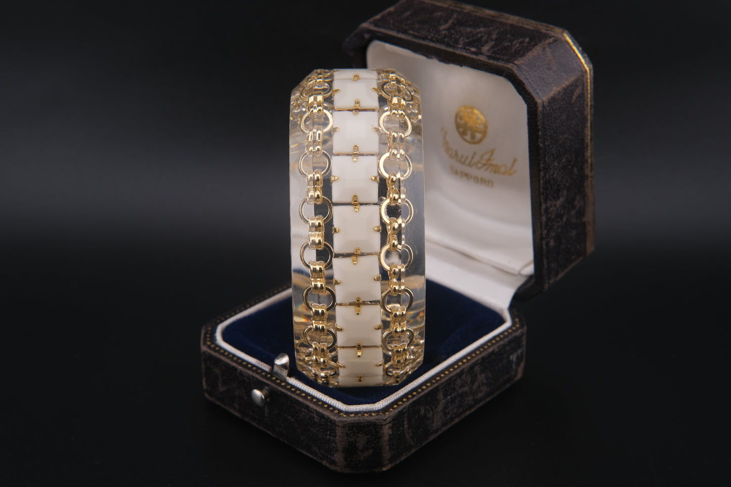 Clear Resin Cuff Bracelet with Gold-Tone Chain and White Inlay – Bold Sculptural Statement