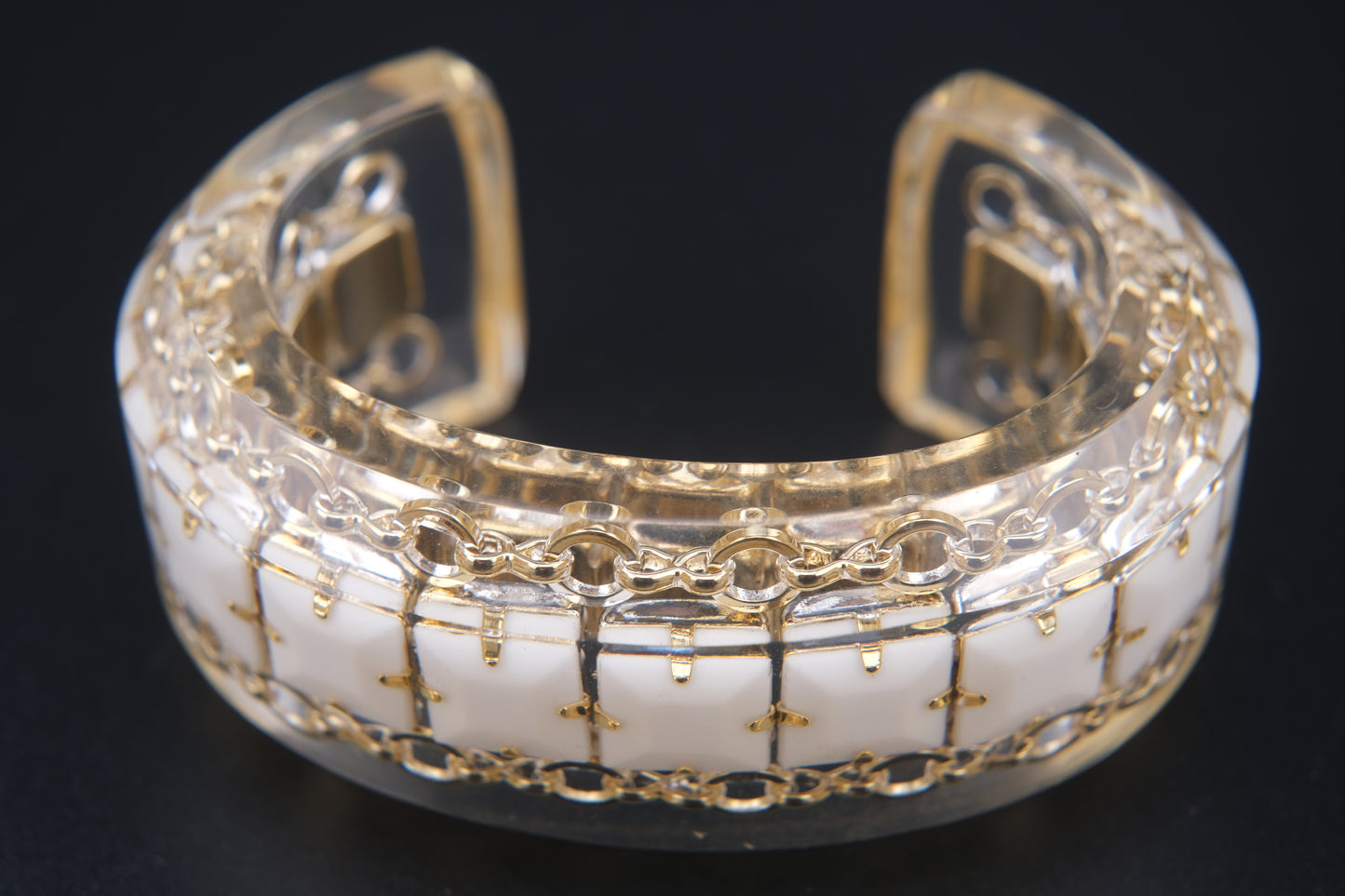 Clear Resin Cuff Bracelet with Gold-Tone Chain and White Inlay – Bold Sculptural Statement