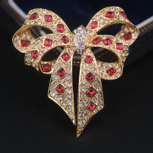 Nina Ricci Bow Brooch – Gold-Tone with Red and Clear Crystals