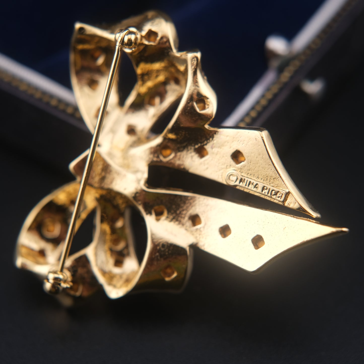 Nina Ricci Bow Brooch – Gold-Tone with Red and Clear Crystals