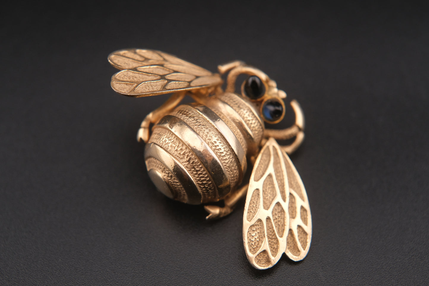 Vintage Wiggle-Wing Bee Brooch – Gold Tone Metal with Black Cabochon Eyes | 1950s–1960s Statement Pin