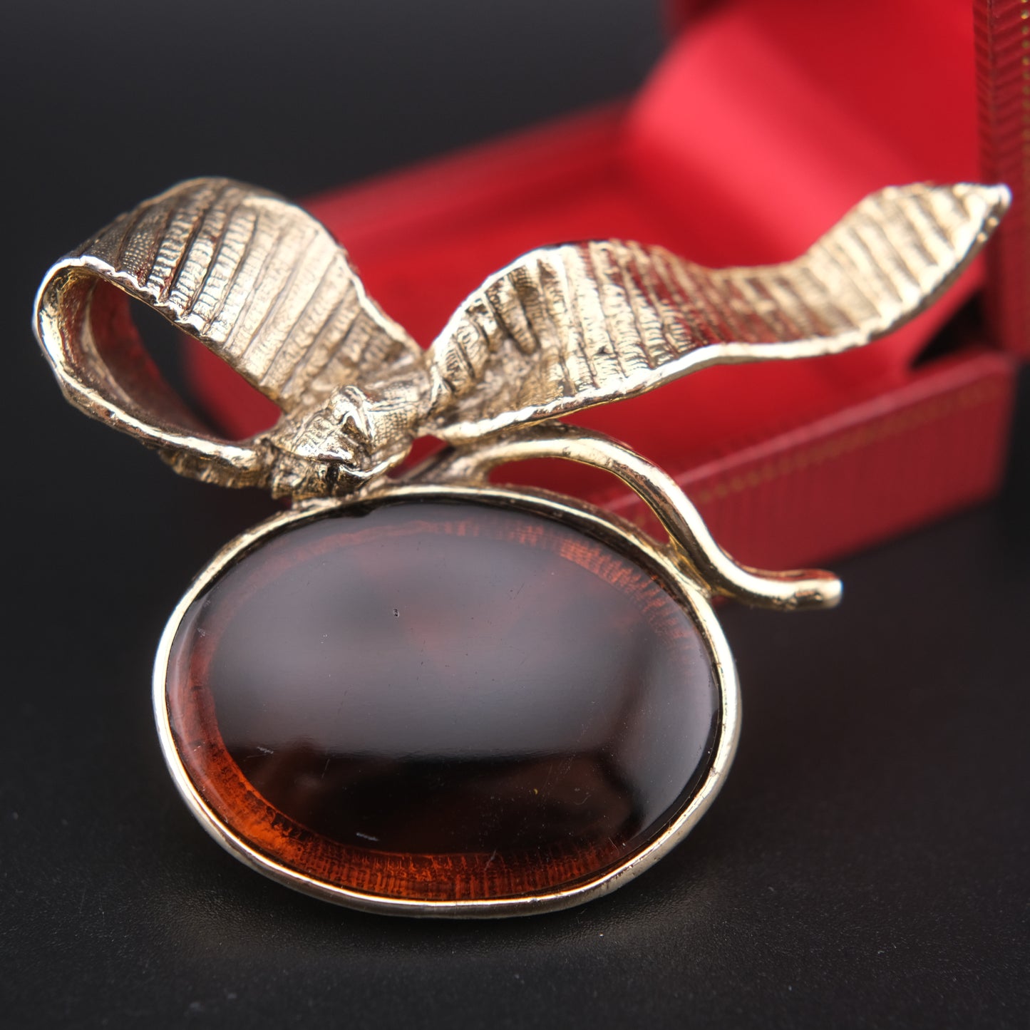Vintage Gold-Tone Ribbon Brooch with Large Amber-Brown Glass Cabochon