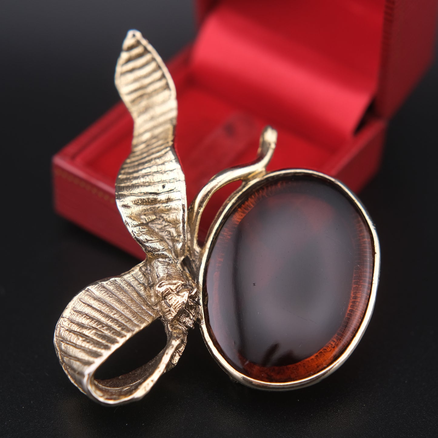 Vintage Gold-Tone Ribbon Brooch with Large Amber-Brown Glass Cabochon