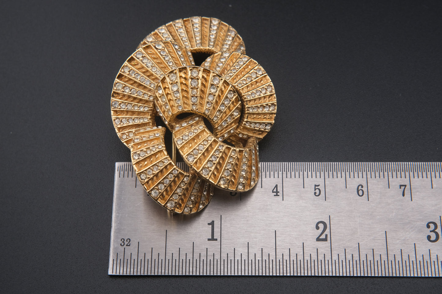 Vintage Ciner Brooch – Gold-Tone Interlocking Loops with Clear Rhinestones