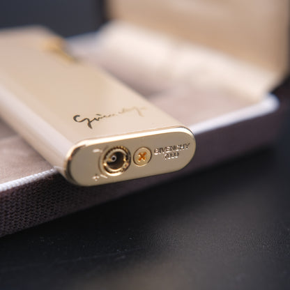 Vintage Givenchy 7000 Butane Lighter – Beige Enamel & Gold-Tone Trim with Signature Case
