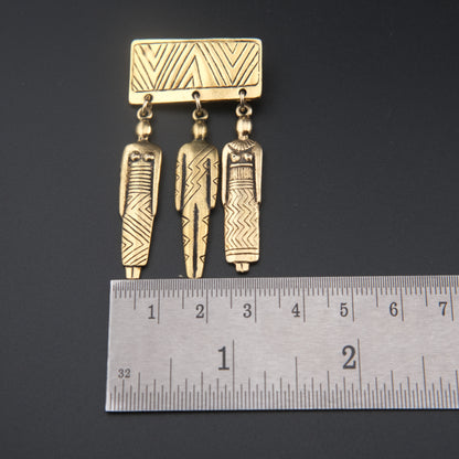 Vintage Signed Laurel Burch Tribal People Dangle Brooch – Gold Tone Bar Pin with Three Figures
