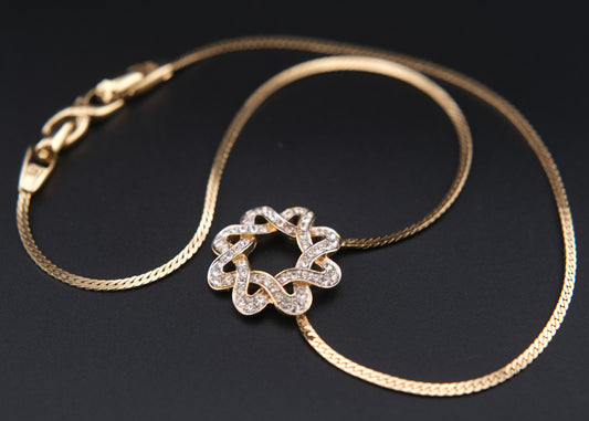 Nina Ricci Star Knot Crystal Necklace – Gold-Tone Choker Style