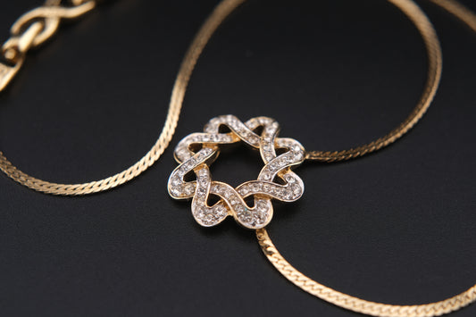 Nina Ricci Star Knot Crystal Necklace – Gold-Tone Choker Style