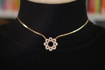 Nina Ricci Star Knot Crystal Necklace – Gold-Tone Choker Style