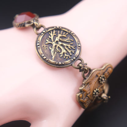 Vintage Multi-Charm Bracelet with Religious and Symbolic Motifs – Snake Locket