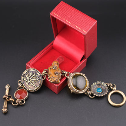 Vintage Multi-Charm Bracelet with Religious and Symbolic Motifs – Snake Locket