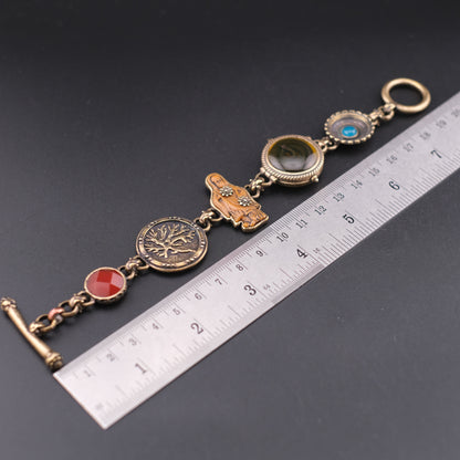 Vintage Multi-Charm Bracelet with Religious and Symbolic Motifs – Snake Locket