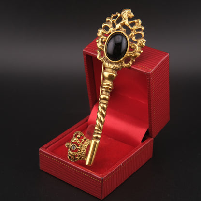 Vintage Gold-Tone Key Brooch with Black Cabochon and Crown Detail