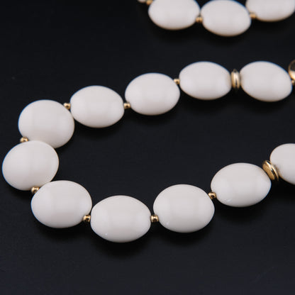 Vintage Trifari White Lucite Station Necklace with Sculptural Gold-Tone Accents