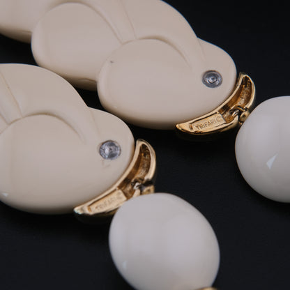 Vintage Trifari White Lucite Station Necklace with Sculptural Gold-Tone Accents