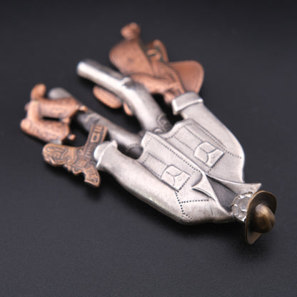 Vintage Cowboy Figural Brooch – Gun & Boots Western Motif with Rhinestone Face, Oxidized Silver & Copper Tone