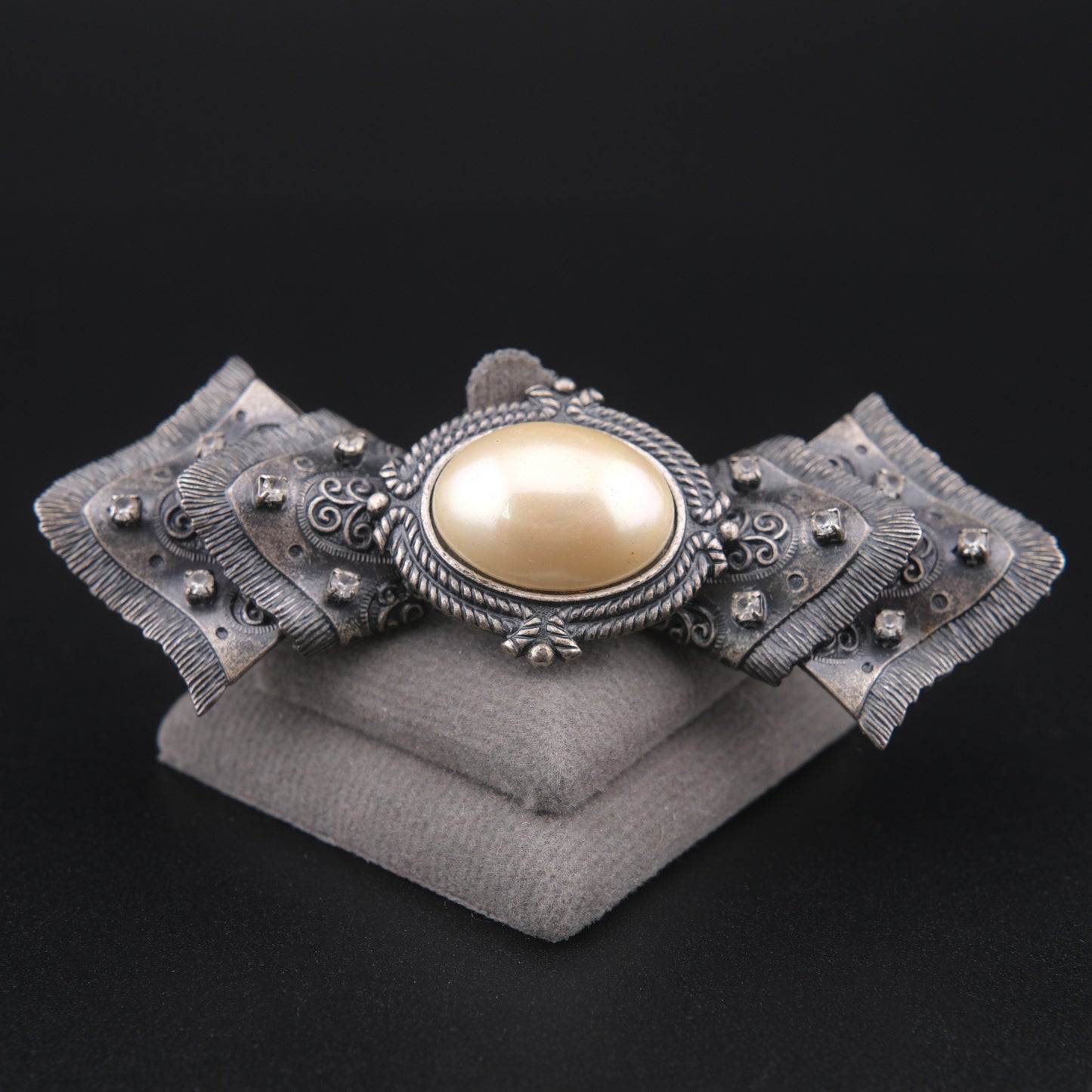Vintage Sculptural Bow Brooch in Oxidized Silver Tone with Oval Ivory Cabochon and Rhinestone Accents, Signed