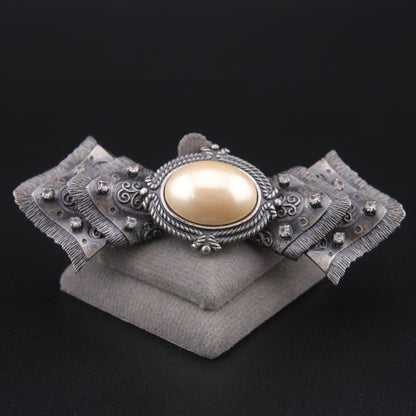 Vintage Sculptural Bow Brooch in Oxidized Silver Tone with Oval Ivory Cabochon and Rhinestone Accents, Signed