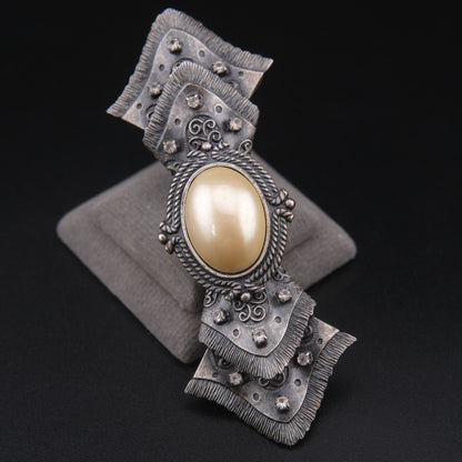 Vintage Sculptural Bow Brooch in Oxidized Silver Tone with Oval Ivory Cabochon and Rhinestone Accents, Signed