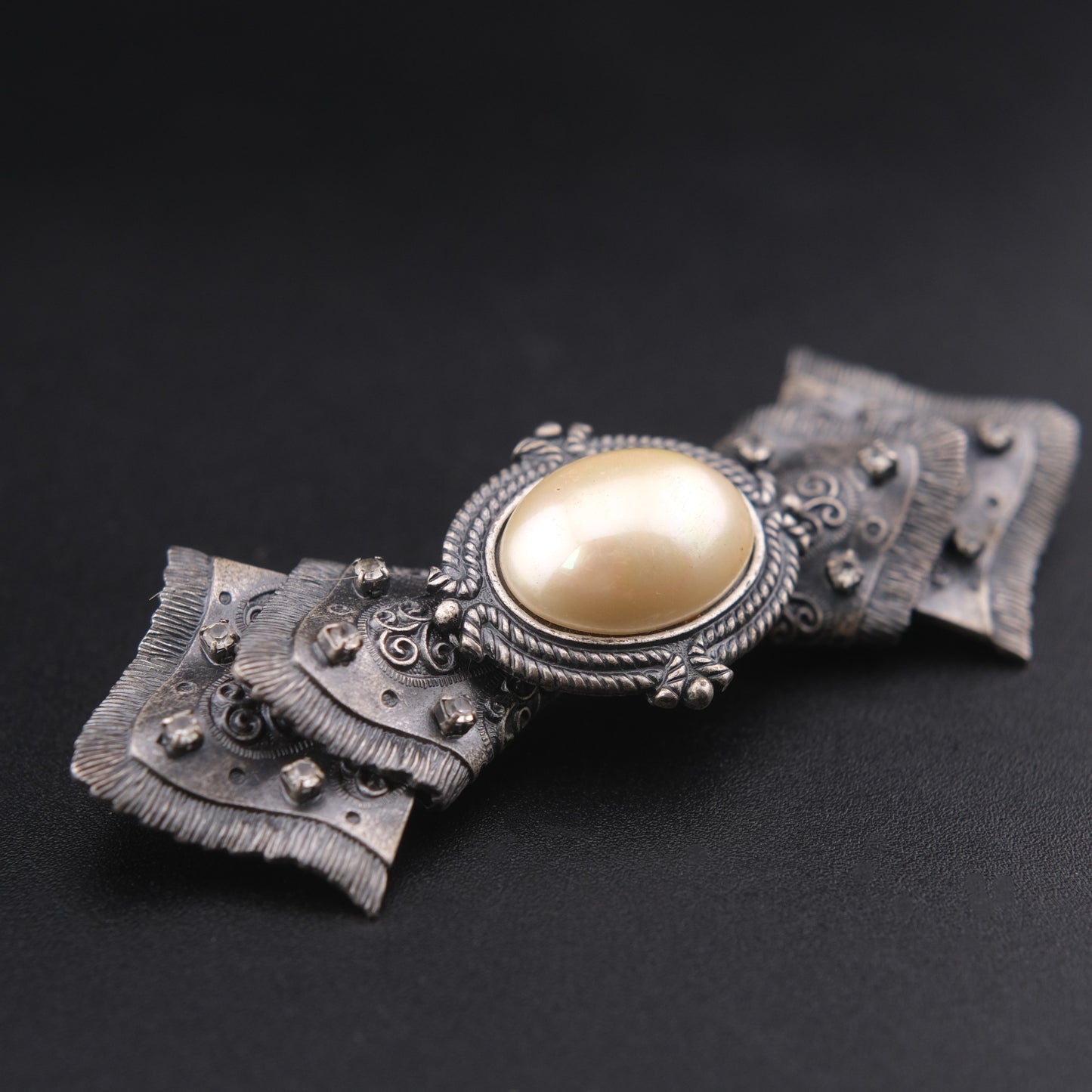 Vintage Sculptural Bow Brooch in Oxidized Silver Tone with Oval Ivory Cabochon and Rhinestone Accents, Signed