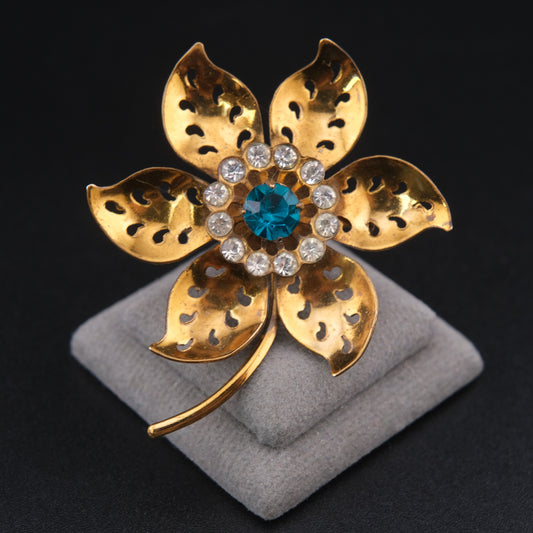 Vintage Coro Brass Flower Brooch with Teal Blue Rhinestone Center