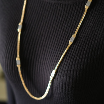 Vintage Nina Ricci Station Necklace – Gold-Tone with Brushed Metal Accents