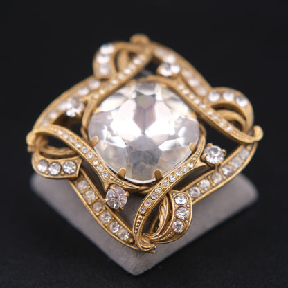❤️ Vintage Gold-Tone Rhinestone Brooch with Large Faceted Crystal Center, Sculptural Ribbon Design