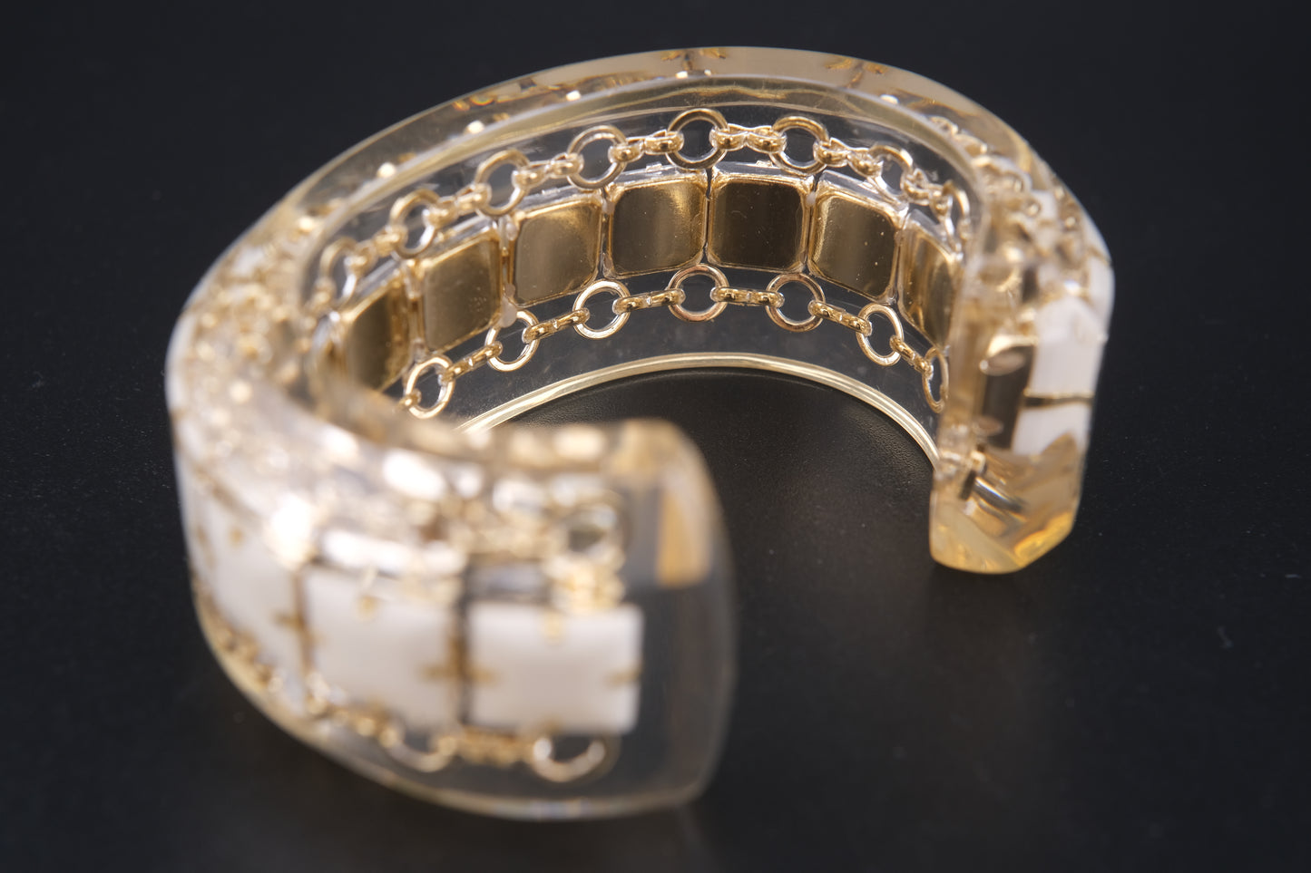 Clear Resin Cuff Bracelet with Gold-Tone Chain and White Inlay – Bold Sculptural Statement