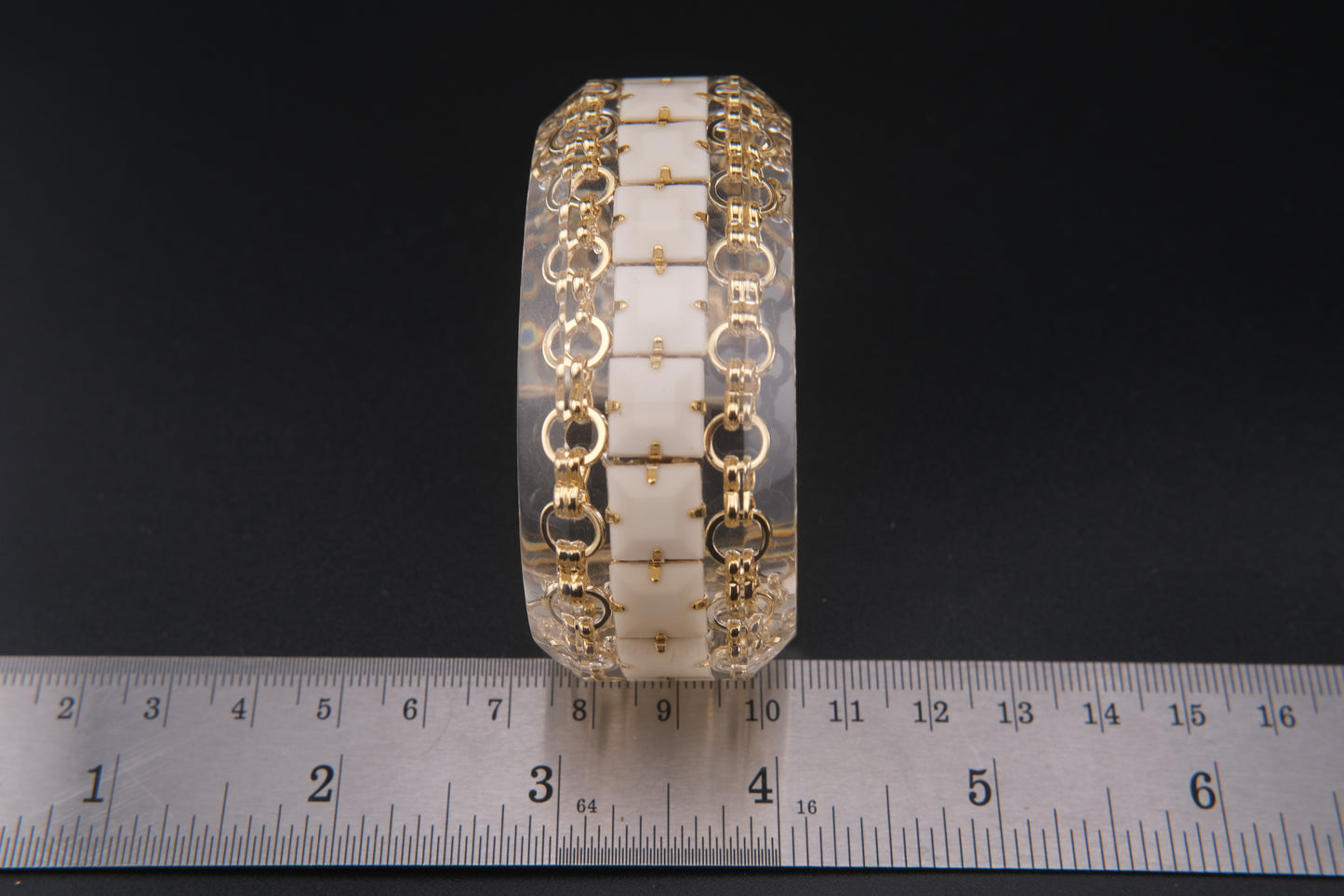 Clear Resin Cuff Bracelet with Gold-Tone Chain and White Inlay – Bold Sculptural Statement
