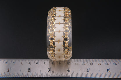 Clear Resin Cuff Bracelet with Gold-Tone Chain and White Inlay – Bold Sculptural Statement
