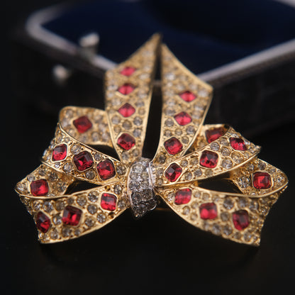 Nina Ricci Bow Brooch – Gold-Tone with Red and Clear Crystals
