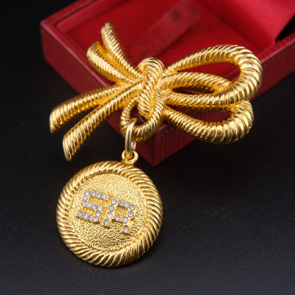 ❤️ Sonia Rykiel Bow Medallion Brooch – Gold-Tone with Crystal "SR" Logo