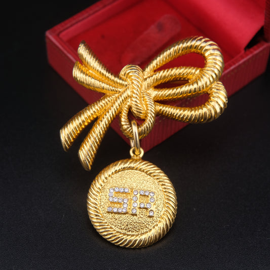 ❤️ Sonia Rykiel Bow Medallion Brooch – Gold-Tone with Crystal "SR" Logo