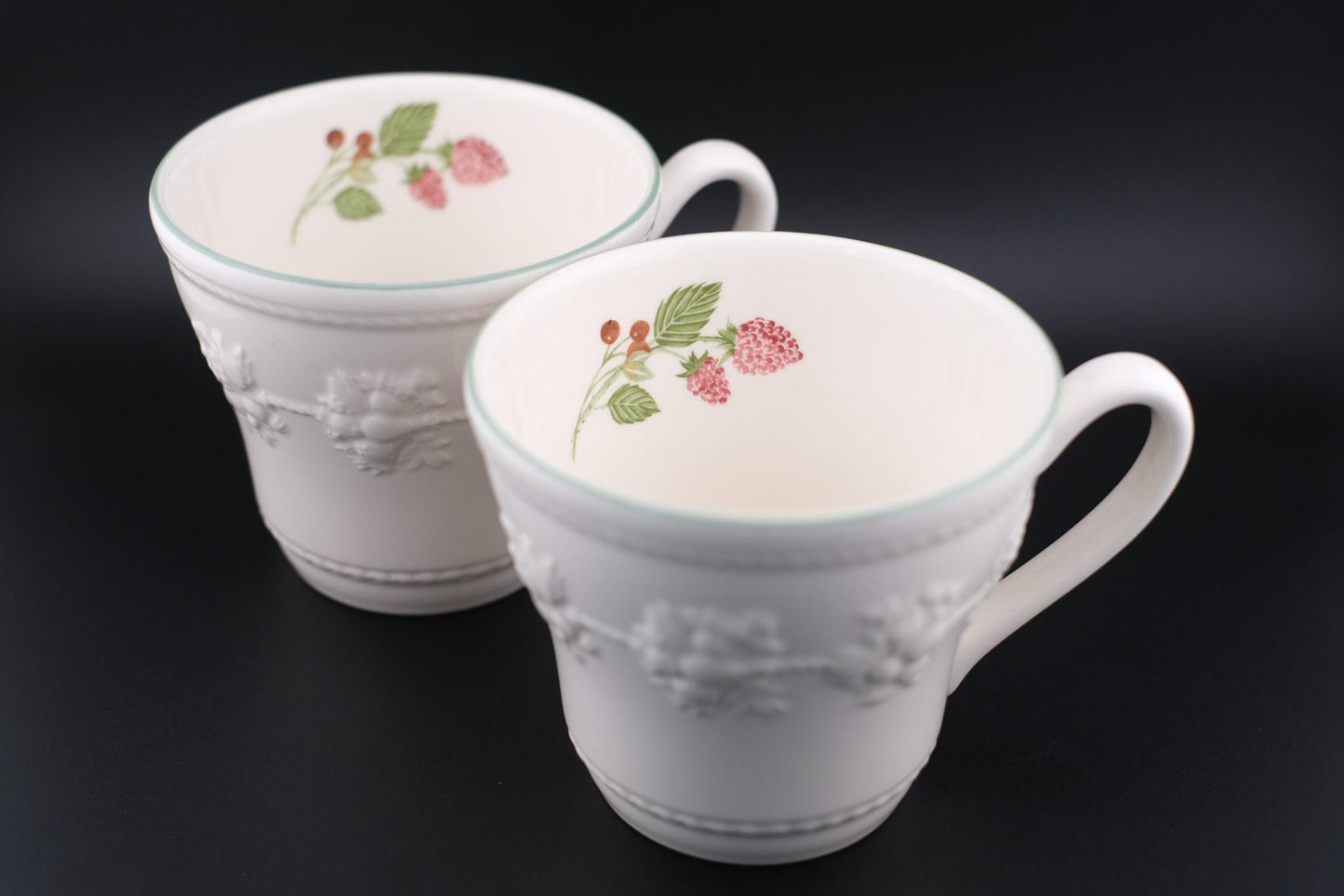 Wedgwood Festivity Raspberry Queen’s Ware Mug Pair – White Embossed Relief with Raspberry Interior Motif
