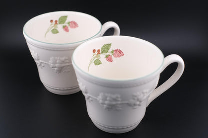 Wedgwood Festivity Raspberry Queen’s Ware Mug Pair – White Embossed Relief with Raspberry Interior Motif