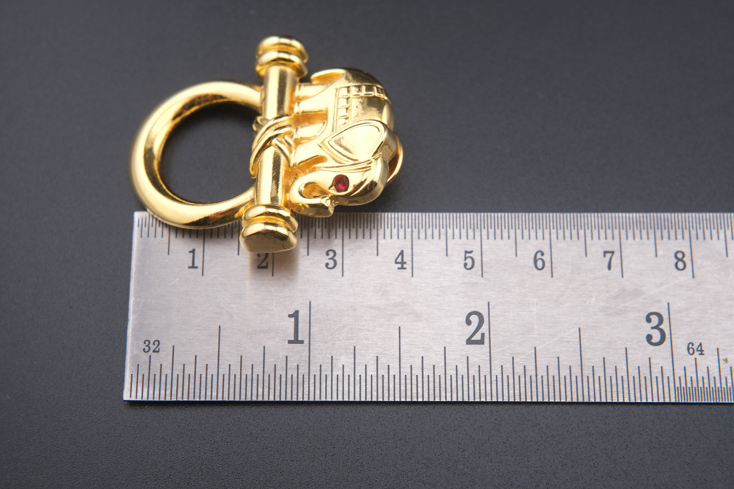 Vintage Malka Paris Elephant Pin – Gilded Gold-Tone with Red Crystal Eye, Made in France