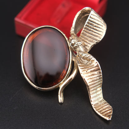 Vintage Gold-Tone Ribbon Brooch with Large Amber-Brown Glass Cabochon