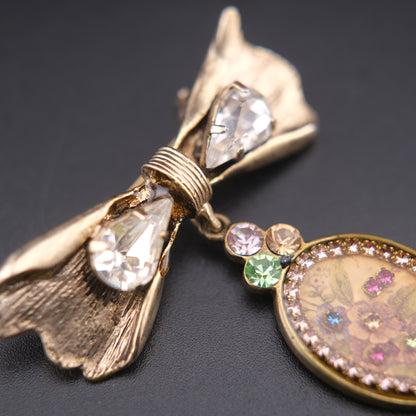 Vintage Michal Negrin Bow & Floral Drop Brooch – Crystal Accents, Romantic Design