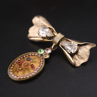 Vintage Michal Negrin Bow & Floral Drop Brooch – Crystal Accents, Romantic Design
