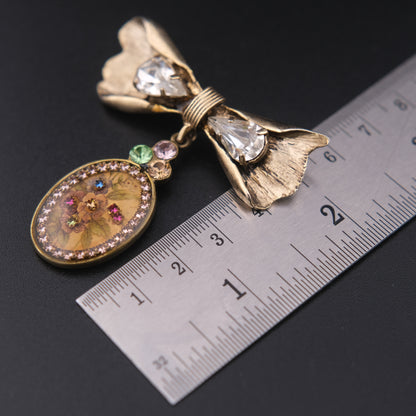Vintage Michal Negrin Bow & Floral Drop Brooch – Crystal Accents, Romantic Design