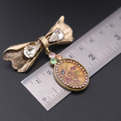 Vintage Michal Negrin Bow & Floral Drop Brooch – Crystal Accents, Romantic Design