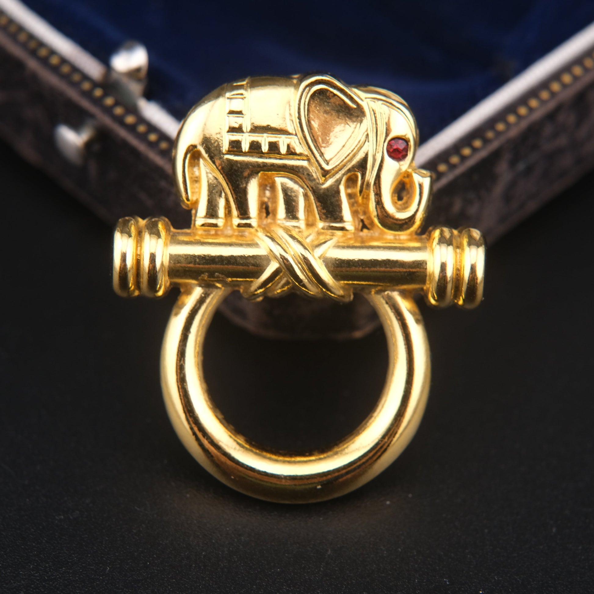 Vintage Malka Paris elephant brooch pin in gold tone with red crystal eye, French collectible jewelry