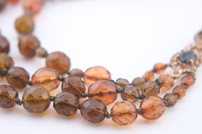 Vintage Monet Triple Strand Beaded Necklace – Faceted Amber & Smoky Brown with Rhinestone Accents